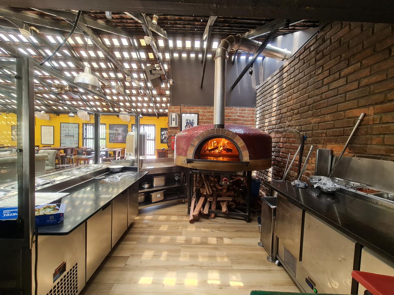 Pizzeria kitchen with wood-fired oven